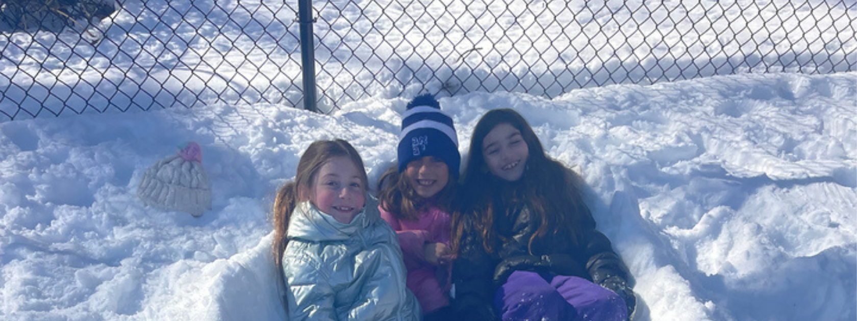 Friends playing in the snow together