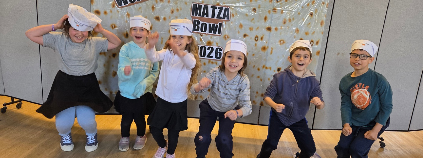 students making matzah together